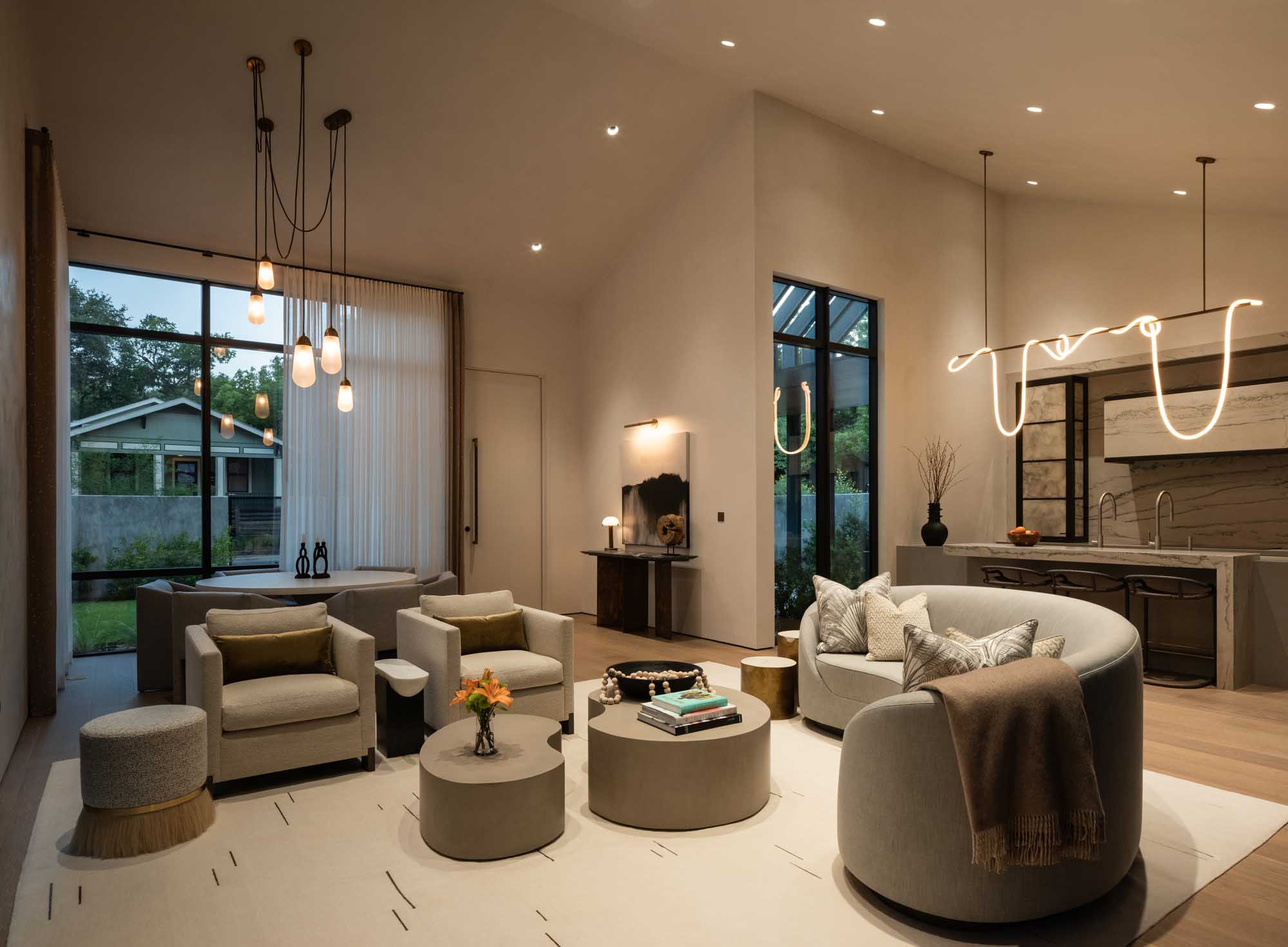Modern living room with warm layered lighting and contemporary furniture