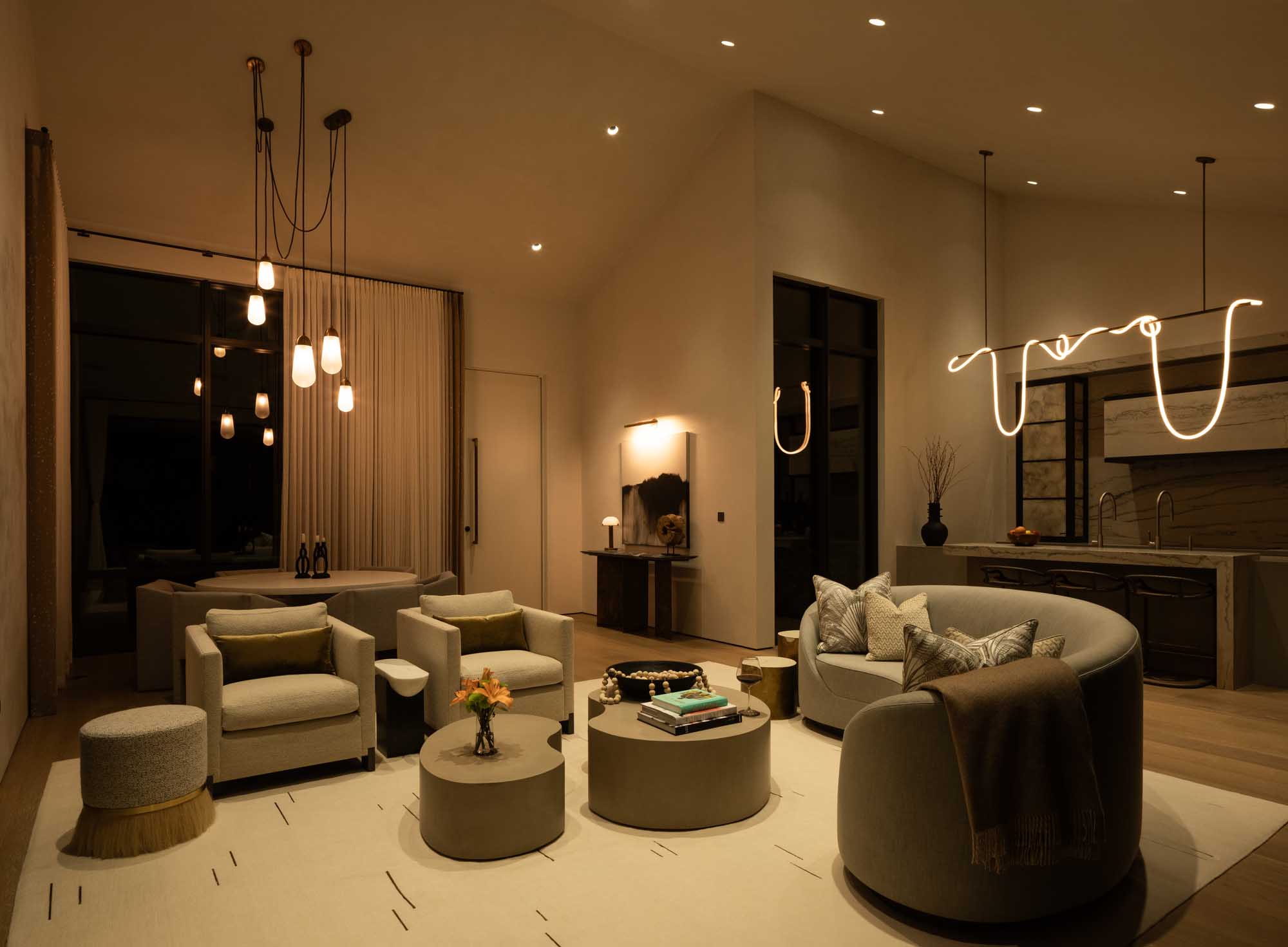 Cozy living room with warm lighting highlighting seating and décor