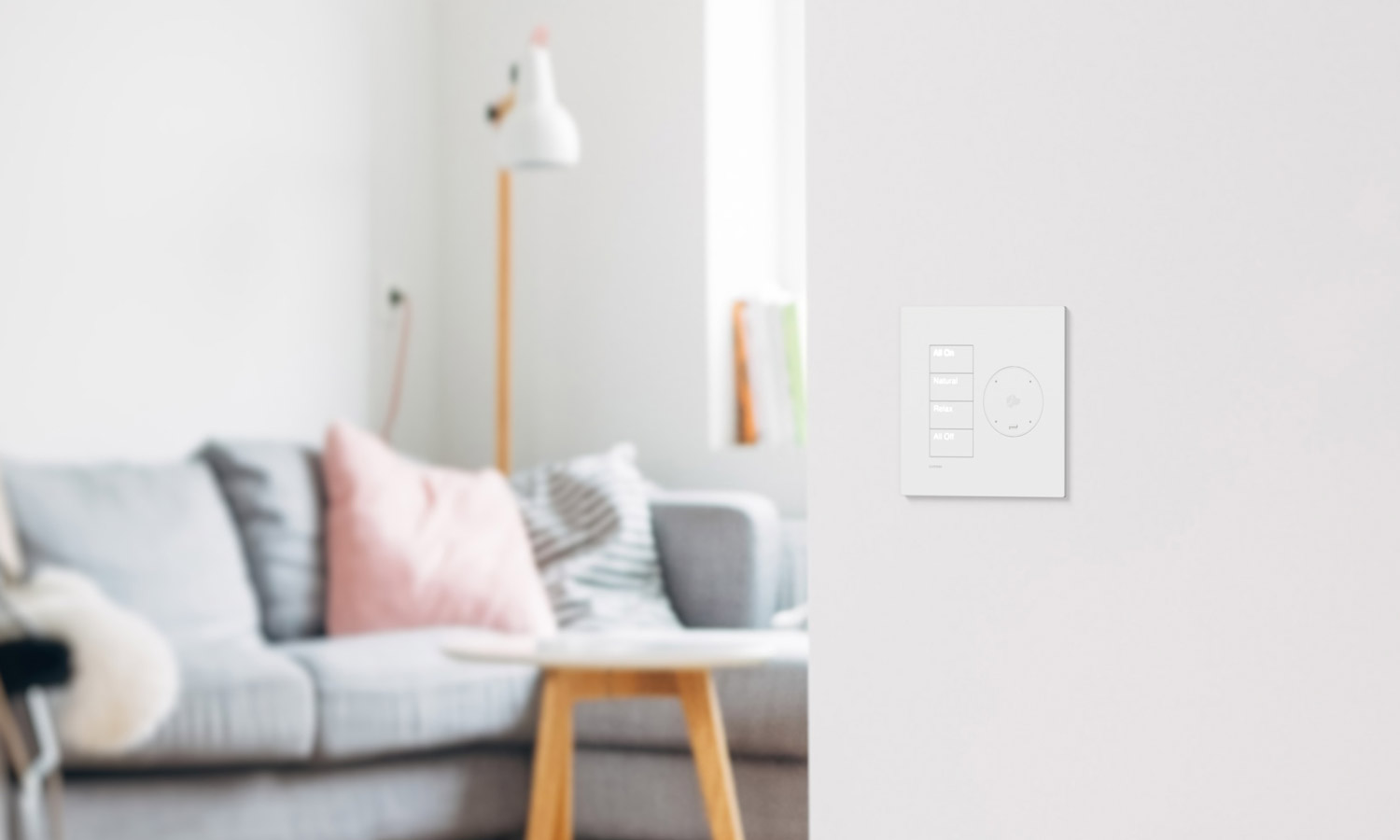 White wall keypad in a living room with soft decor