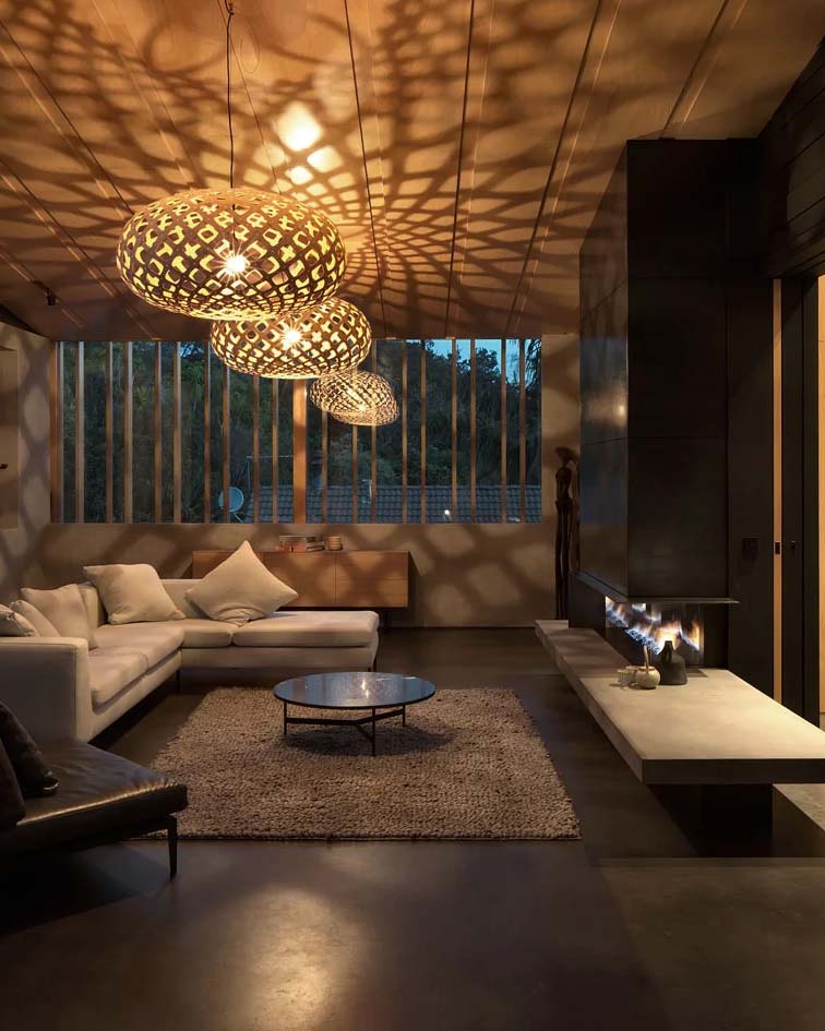 Living room with patterned pendant lights casting decorative shadows