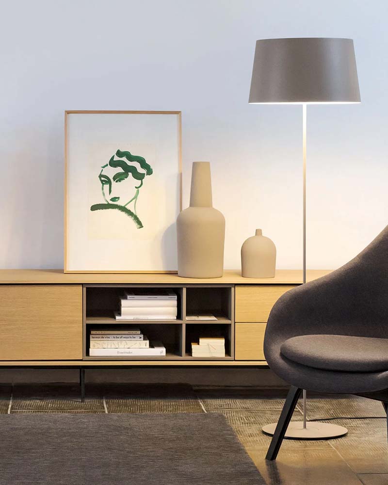 Minimalist living room with floor lamp and modern artwork