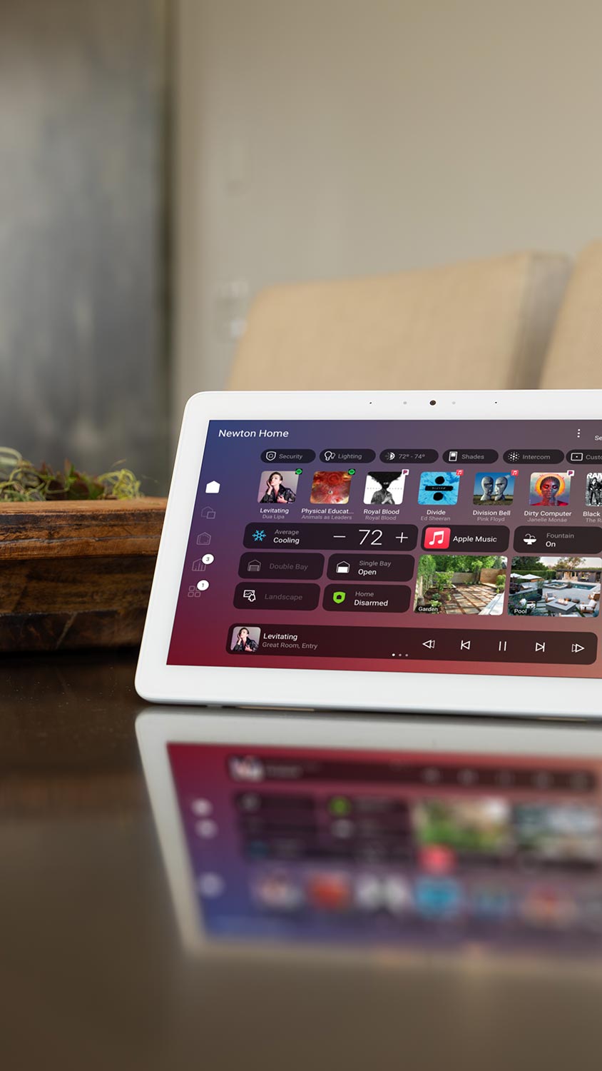 Smart home control panel on table showing music, lighting, and climate options