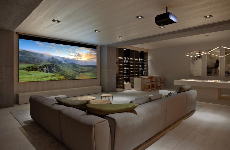 A casual home theater with a large screen, Sony projector, wine bar, pool table, and sectional.