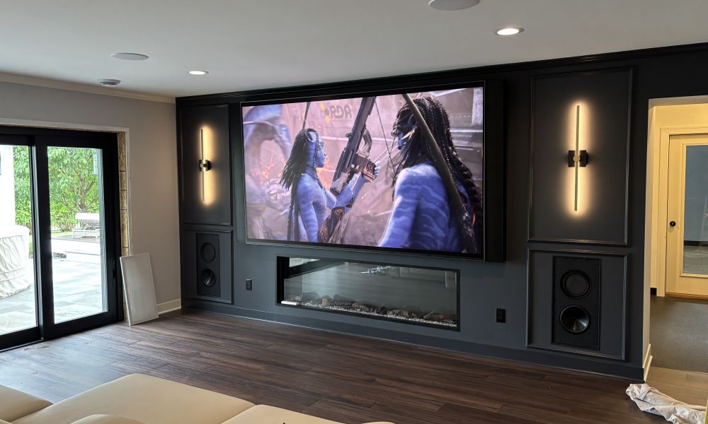 <span class="uk-h4">115-inch TV with in-wall speakers and linear fireplace in a Lakeville, MN home media room installed by Signal AV</span>