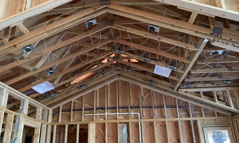 <span class="uk-h4">`A vaulted ceiling under construction, with ceiling boxes and low-voltage cable runs installed before the drywall goes up.`</span>