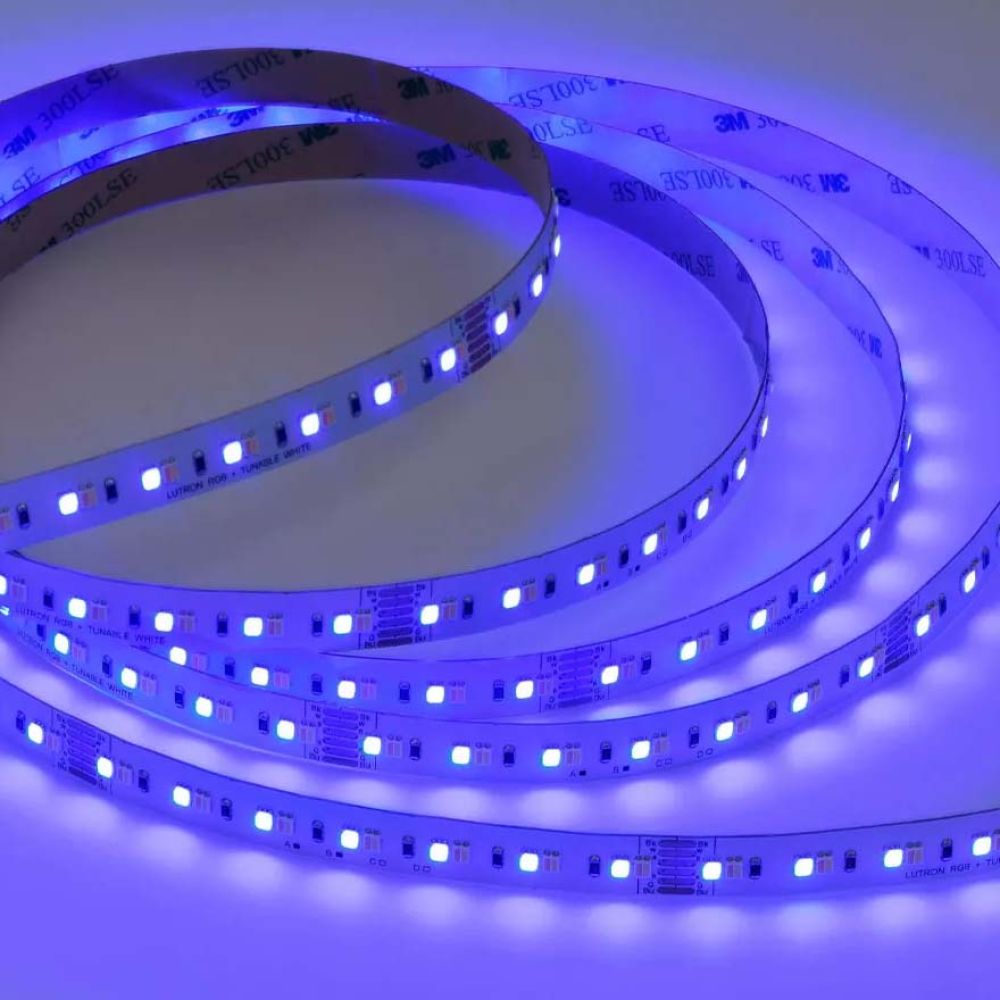 Blue LED tape lighting strip glowing on a white surface